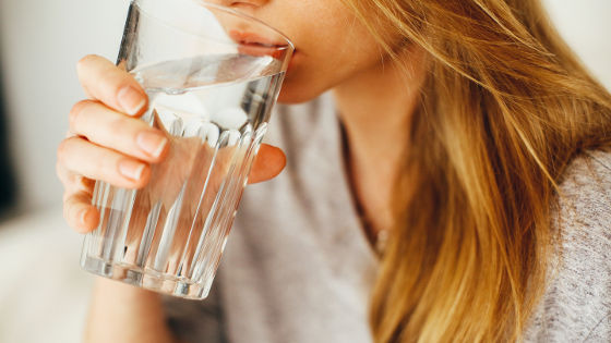 young woman drinking water